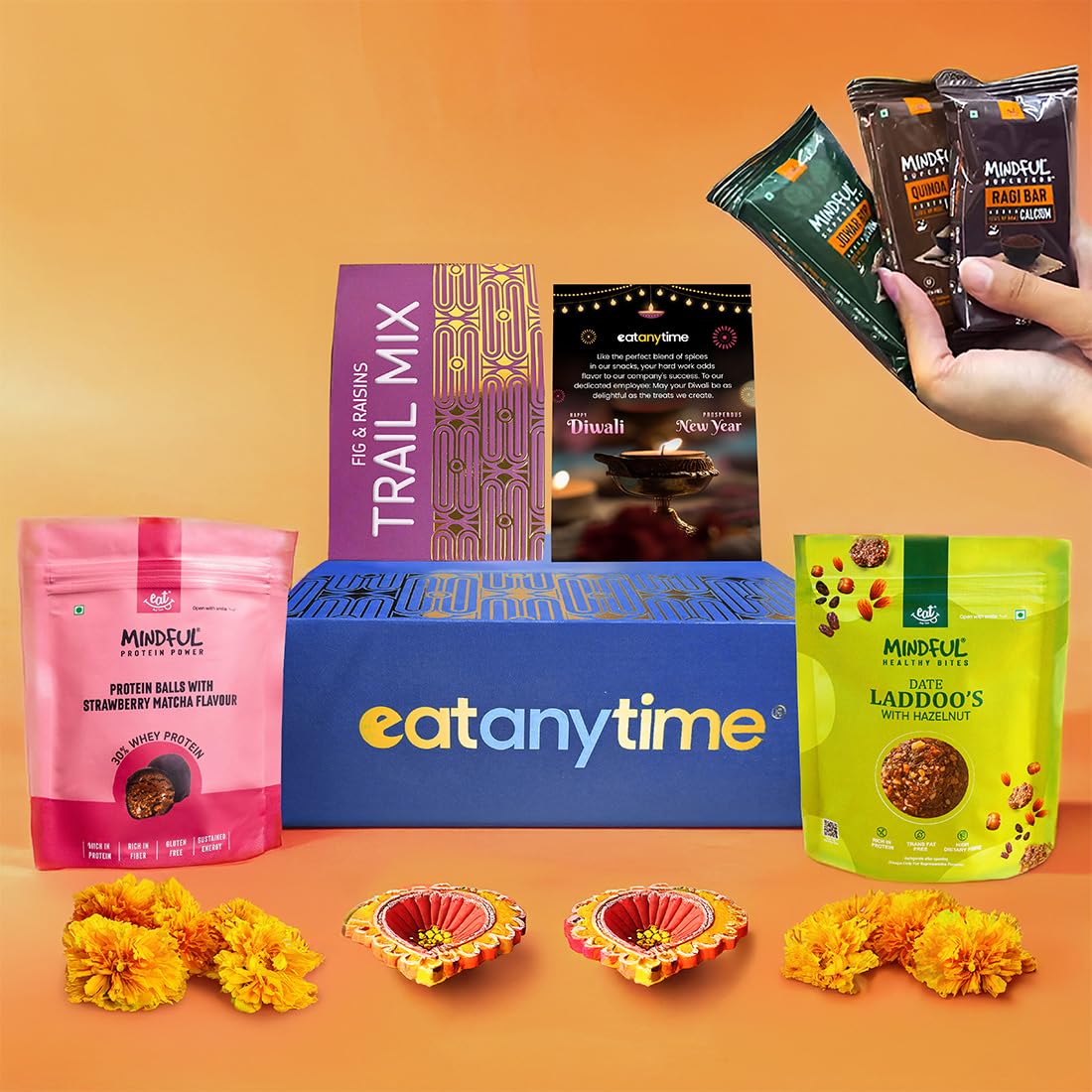 Eat Anytime Premium Diwali Gift Hamper With Hazlenut date Ladoo 50g, Strawberry Mocha Protein Balls 50g, Millet Bar Pack of 3, Trail Mix 75g, Diya &amp; Premium Diwali Gift Box